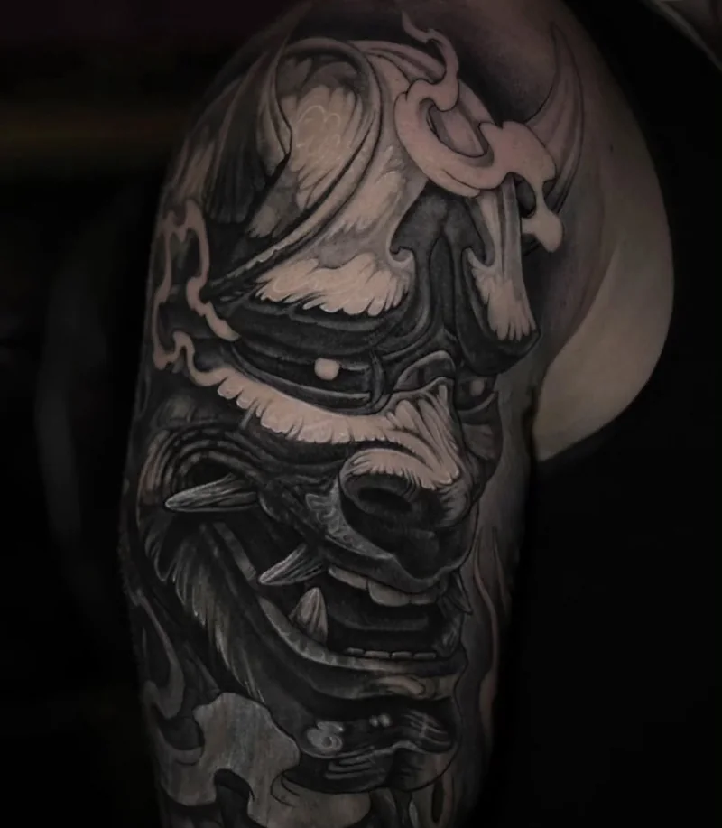 Black and grey Japanese mask tattoo by Stefano Alcántara