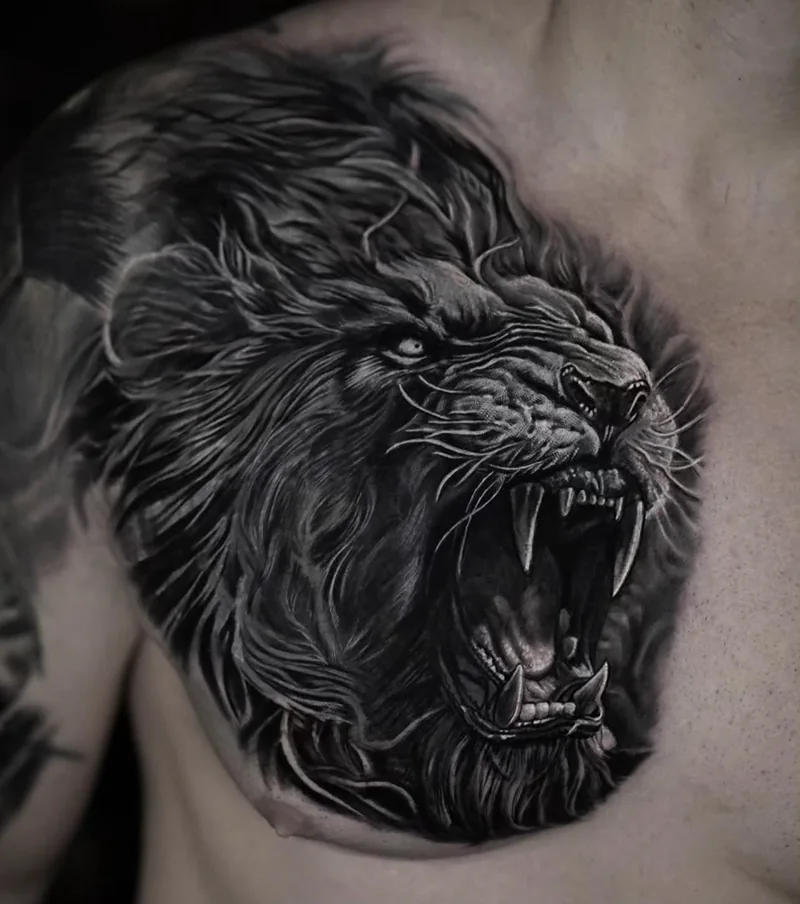 Black and grey lion tattoo by Stefano Alcántara