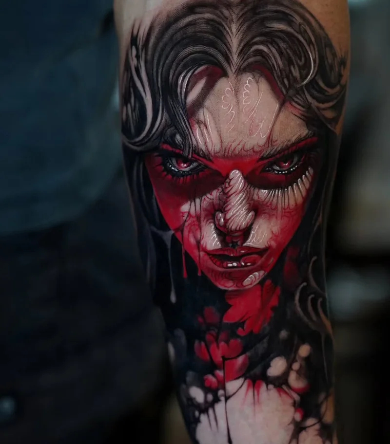 Red and black portrait tattoo by Stefano Alcántara